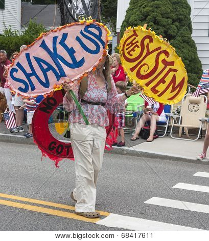 Woman walking in the Wellfleet 4th of July Parade in Wellfleet, Massachusetts.
