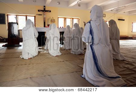 KOLKATA, INDIA - FEBRUARY 08: Sisters of Mother Teresa's Missionaries of Charity in prayer in the chapel of the Mother House, Kolkata, India at February 08, 2014.