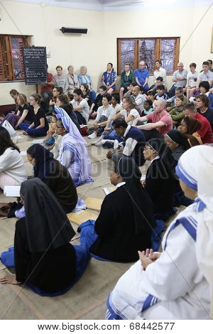 KOLKATA, INDIA - FEBRUARY 15: Sisters of Mother Teresa's Missionaries of Charity and volunteers from around the world at the Mass in the chapel of the Mother House, Kolkata, India at February 15, 2014