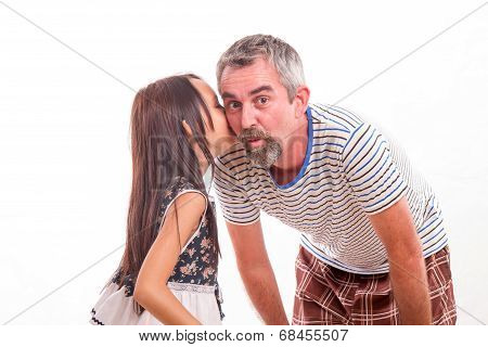Daughter Whispering Secret In Dad's Ear
