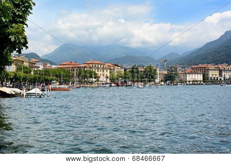 LUGANO, SWITZERLAND - JULY 5, 2014: Lugano city and shoreline.The affluent city in southern Switzerland sits on the shores of Lake Lugano surrounded by the Lugano Prealps bordering Italy.