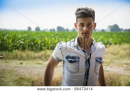 Handsome Young Man Standing, With Coutryside Dirt Road Behind