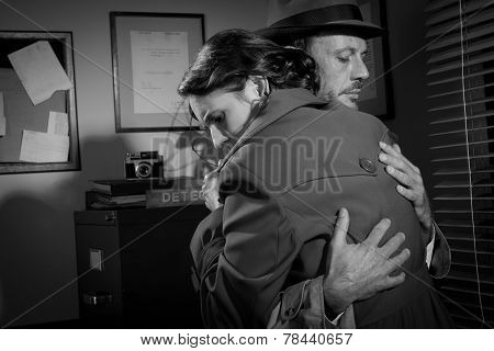 Man Consoling A Young Woman In His Office
