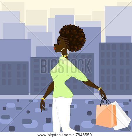 Dark-skinned woman shopping in the city