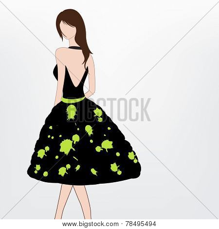 Young modern girl wearing a stylish black backless dress with green print.