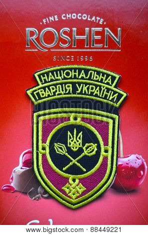 Illustrative editorial.Chevron of Ukrainian National Guard.With logo Roshen Inc. Trademark Roshen is property of ukrainian president Poroshenko.At April 16,2015 in Kiev, Ukraine