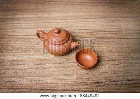 Still Life On Wooden Background: Tea Kettle And Cup