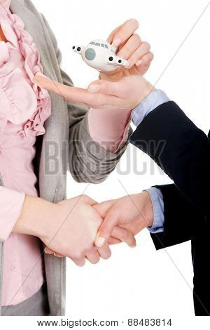 Caucasian businesswoman giving a plane to her partner.