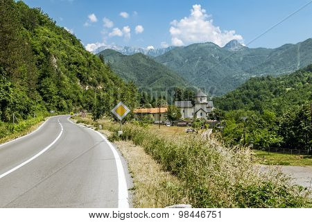 Monastery On The River Moraca Amid Mountains In The Background. Montenegro