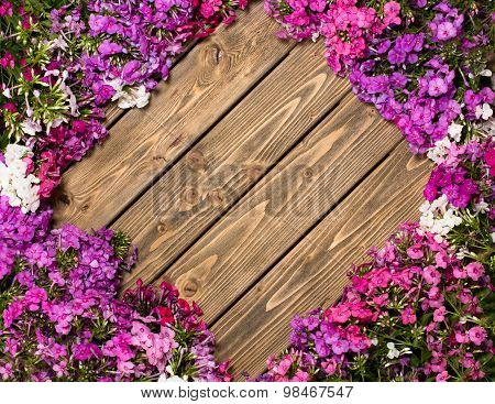 Lilac flowers on wooden background