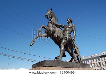 View of Horse tamers monument by Peter Klodt on Anichkov Bridge in Saint-Petersburg Russia. Popular touristic landmark..ST. PETERSBURG, RUSSIA , July 1, 2017