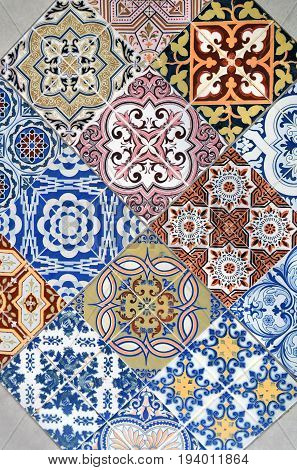 Detail of ornamental ceramic tile with colorful patchwork. Abstract background in oriental style