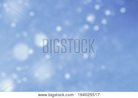 luxury blue glittering light background for copy space concept.
light blue glowing glittering lights abstract bokeh background.  