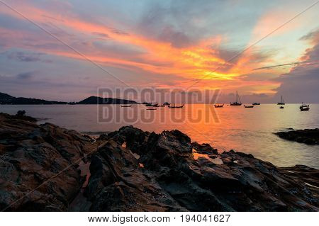 sunset on the beach at kalim bay in phuket thailand