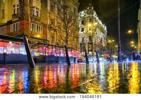 Rainy weather in Budapest at night Hungary. Reflcetion of lights on pavement