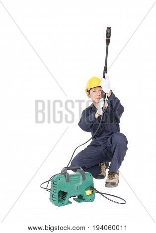 Young Man Sitting And Holding High Pressure Water Gun