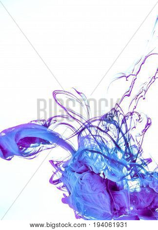 Ink swirl in a water on white background. The paint in the water. Soft dissemination a droplets of colored ink in water close-up. Explosion of color splashes acrylic ink.