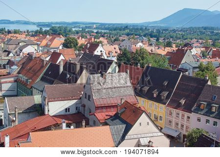 Top view of the beautiful old city with red-tiled roofs and spires