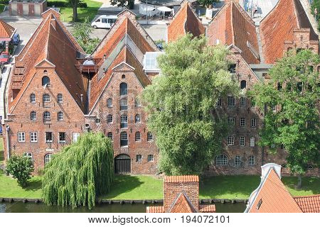 Top view of the beautiful old city with red-tiled roofs and spires
