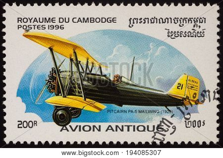 Moscow Russia - July 06 2017: A stamp printed in Cambodia shows American airplane Pitcairn PS-5 Mailwing (1926) developed to carry Air Mail series 