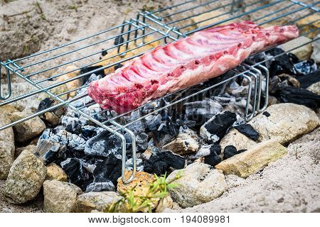 Making Pork Ribs On Homemade Improvised Bbq Barbecue Grill.