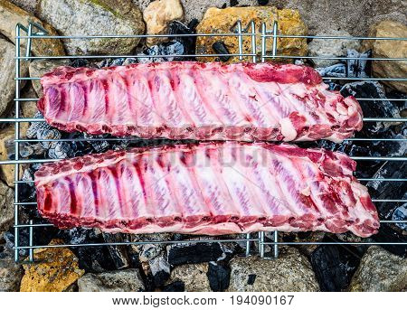 Making Pork Ribs On Homemade Improvised Bbq Barbecue Grill.