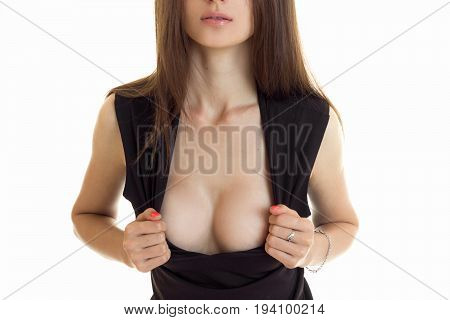 sexual woman shows her big silicon boobs isolated on white background
