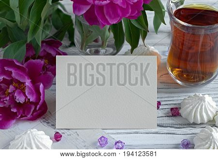 Peonies Flowers Pink Glass Of Tea With Greeting Card Marshmallow On A White Wooden Background - Stoc