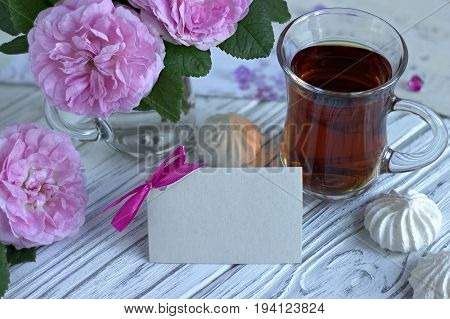 Peonies Flowers Pink Glass Of Tea With Greeting Card Marshmallow On A White Wooden Background - Stoc