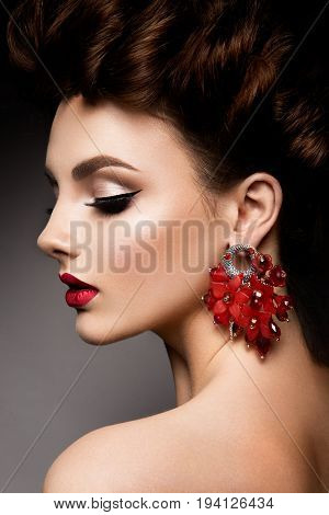 Beauty woman with blue eyes and red lips. Shine skin. Cosmetics.