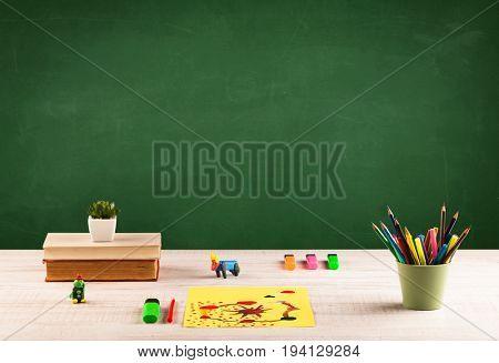 Back to school concepty with clear blackboard background, desk, items