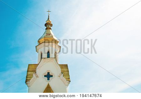 Golden domes of the church against the sky