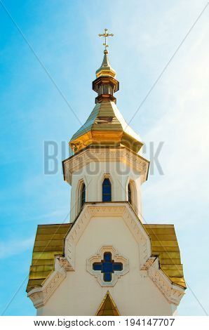 Golden domes of the church against the sky