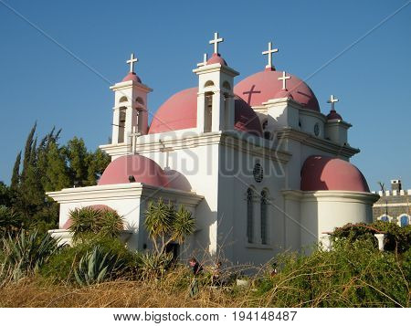 Kapernaum, Israel - October 23, 2010: View of Greek Orthodox Church of the Seven Apostles on the shores of Sea of Galilee in northern Israel.
