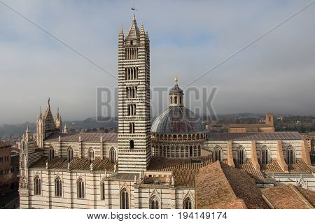 Italy Siena - December 26 2016: the view from facciatone of Duomo di Siena or Metropolitan Cathedral of Santa Maria Assunta on December 26 2016 in Siena Tuscany Italy.