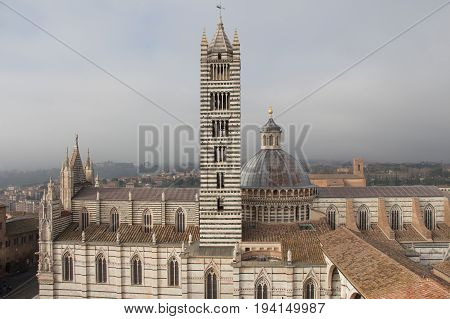 Italy Siena - December 26 2016: the view from facciatone of Duomo di Siena or Metropolitan Cathedral of Santa Maria Assunta on December 26 2016 in Siena Tuscany Italy.
