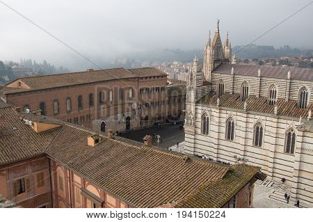 Italy Siena - December 26 2016: the view from facciatone of Duomo di Siena or Metropolitan Cathedral of Santa Maria Assunta on December 26 2016 in Siena Tuscany Italy.