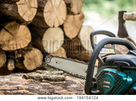 Man Chopping Wood With A Chainsaw