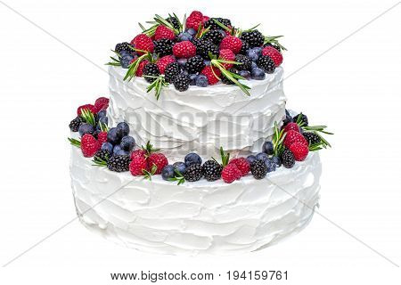 White two-tier cake with fruits isolated on white background