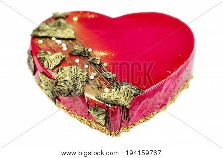 Red heart with gold cake isolated on white background