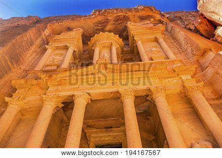 Yellow Golden Treasury Morning Siq Petra Jordan Petra Jordan. Treasury built by the Nabataens in 100 BC. Yellow Canyon becomes rose red when sun goes. Inside buildings walls create many abstracts close up. The rose red can become blood red. Reds are creat
