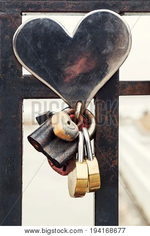 Traditions for lovers. Locks for eternal love. Metal bridge with locks