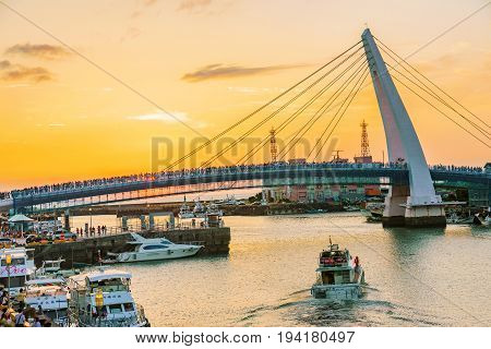 TAIPEI TAIWAN - MAY 29: This is a view of lover's bridge in fisherman's wharf it is a famous bridge where couples come to view the sunset in the Tamsui area on May 29 2017 in Taipei