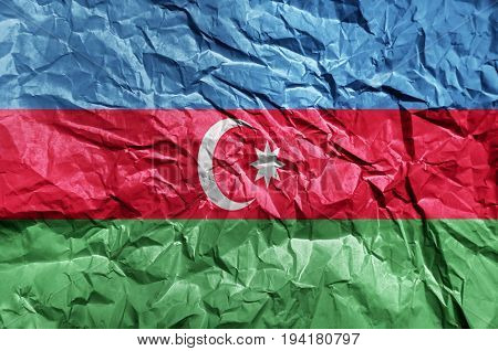 Azerbeijan flag painted on crumpled paper background