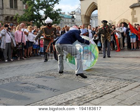 CRACOW POLAND - JULY 5 2017: 30th Street - International Festival of Street Theaters in Cracow Poland. An Odyssey Towards New Shores - a street parade