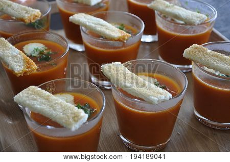 Gazpacho with toast presented on a platter