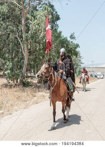 Tiberias Israel July 01 2017 : Participants in the reconstruction of Horns of Hattin battle in 1187 left the camp on horseback and ride go to the battle site near TIberias Israel