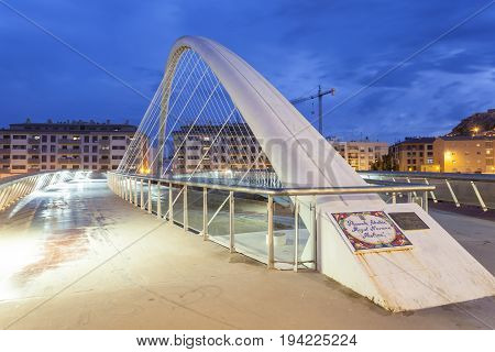 Lorca Spain - May 29 2017: Modern bridge over the Guadalentin river in Lorca illuminated at night. Province of Murcia southern Spain