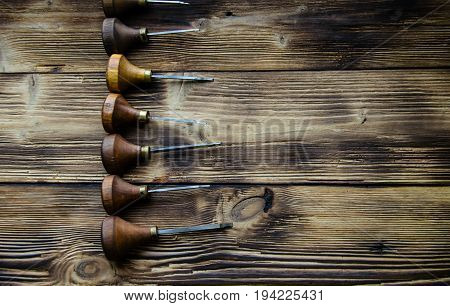 Different Gravers For Jewelry On Wooden Background