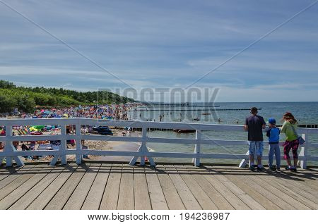 USTRONIE MORSKIE, WEST POMERANIAN / POLAND - 2017: Summer holiday on the sunny beach of the Baltic Sea